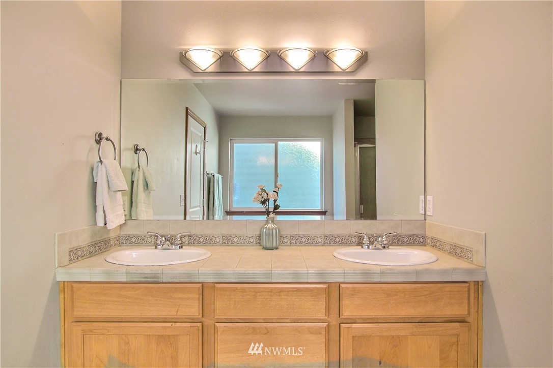 3827 160th Place Southeast Bothell, WA 98012 - Photo 28 of 40 a bathroom with a sink and a mirror