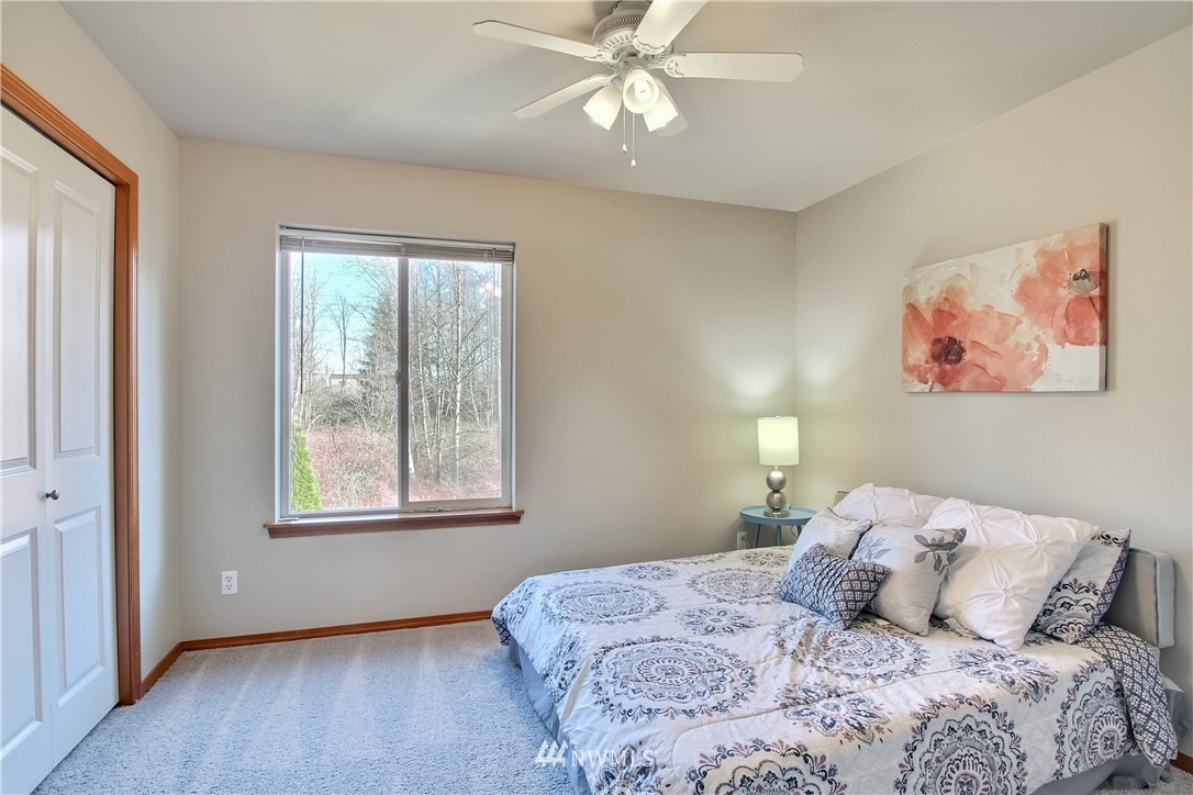 3827 160th Place Southeast Bothell, WA 98012 - Photo 30 of 40 a bedroom with a bed and a window