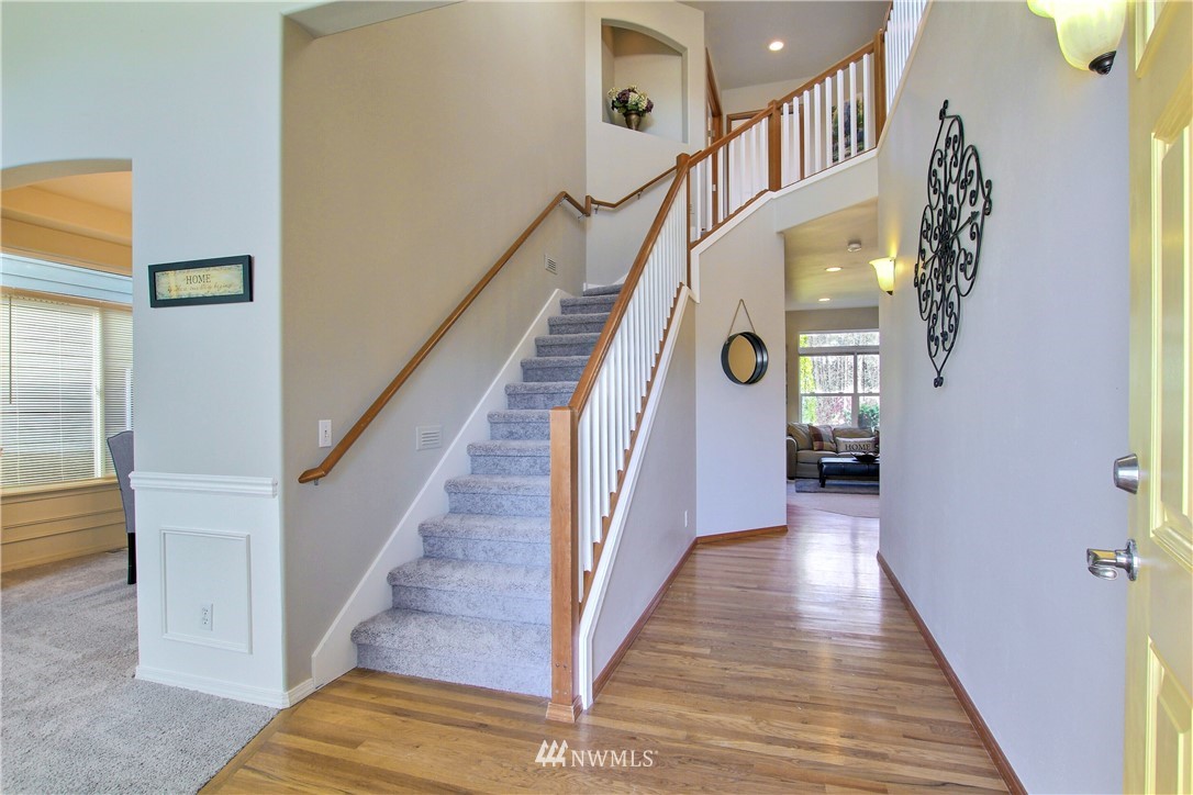 3827 160th Place Southeast Bothell, WA 98012 - Photo 4 of 40 a view of entryway and hall with wooden floor