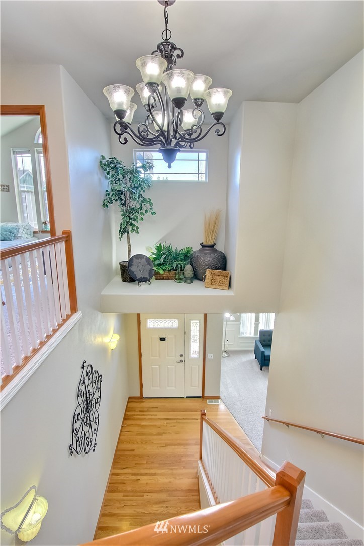 3827 160th Place Southeast Bothell, WA 98012 - Photo 5 of 40 a view of hall way with furniture and chandelier