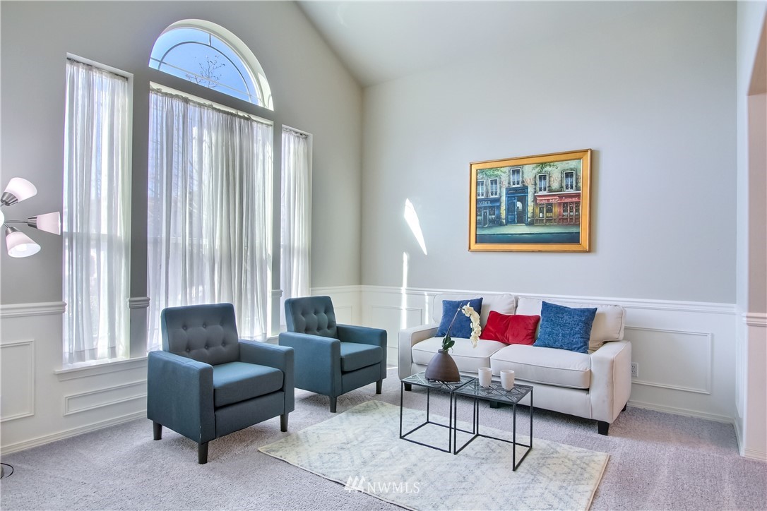 3827 160th Place Southeast Bothell, WA 98012 - Photo 6 of 40 a living room with furniture and a window