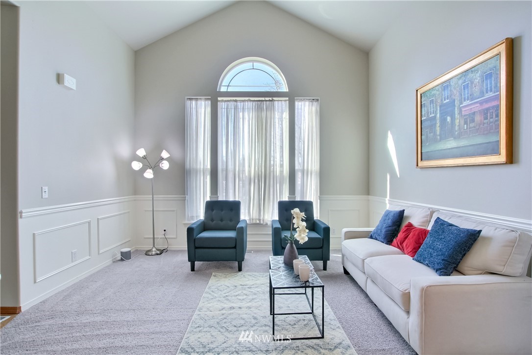 3827 160th Place Southeast Bothell, WA 98012 - Photo 7 of 40 a living room with furniture and a large window