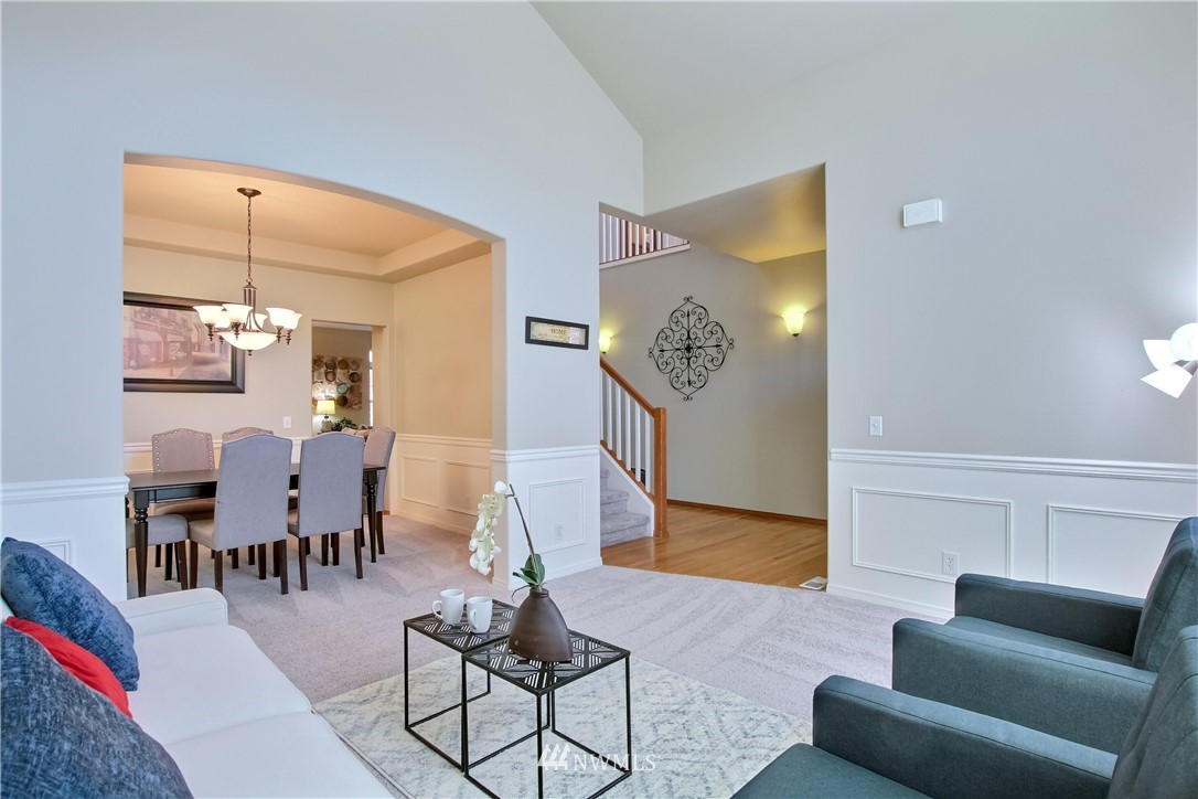 3827 160th Place Southeast Bothell, WA 98012 - Photo 8 of 40 a living room with furniture and wooden floor