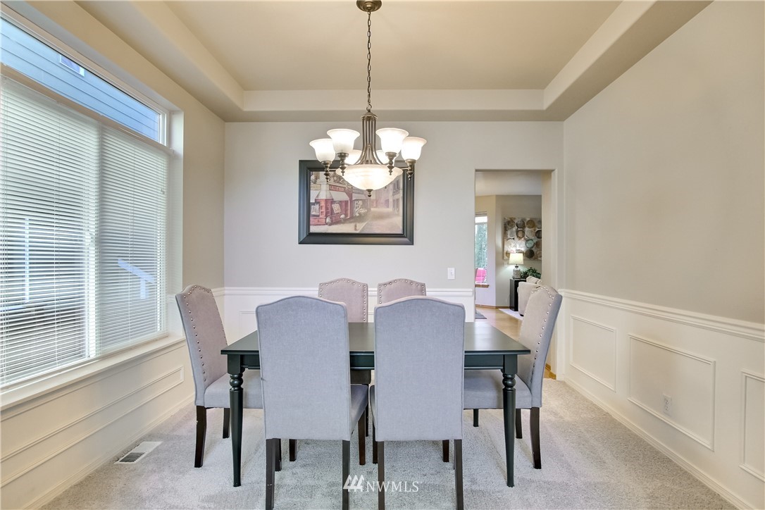 3827 160th Place Southeast Bothell, WA 98012 - Photo 9 of 40 a view of a dining room with furniture window and outside view