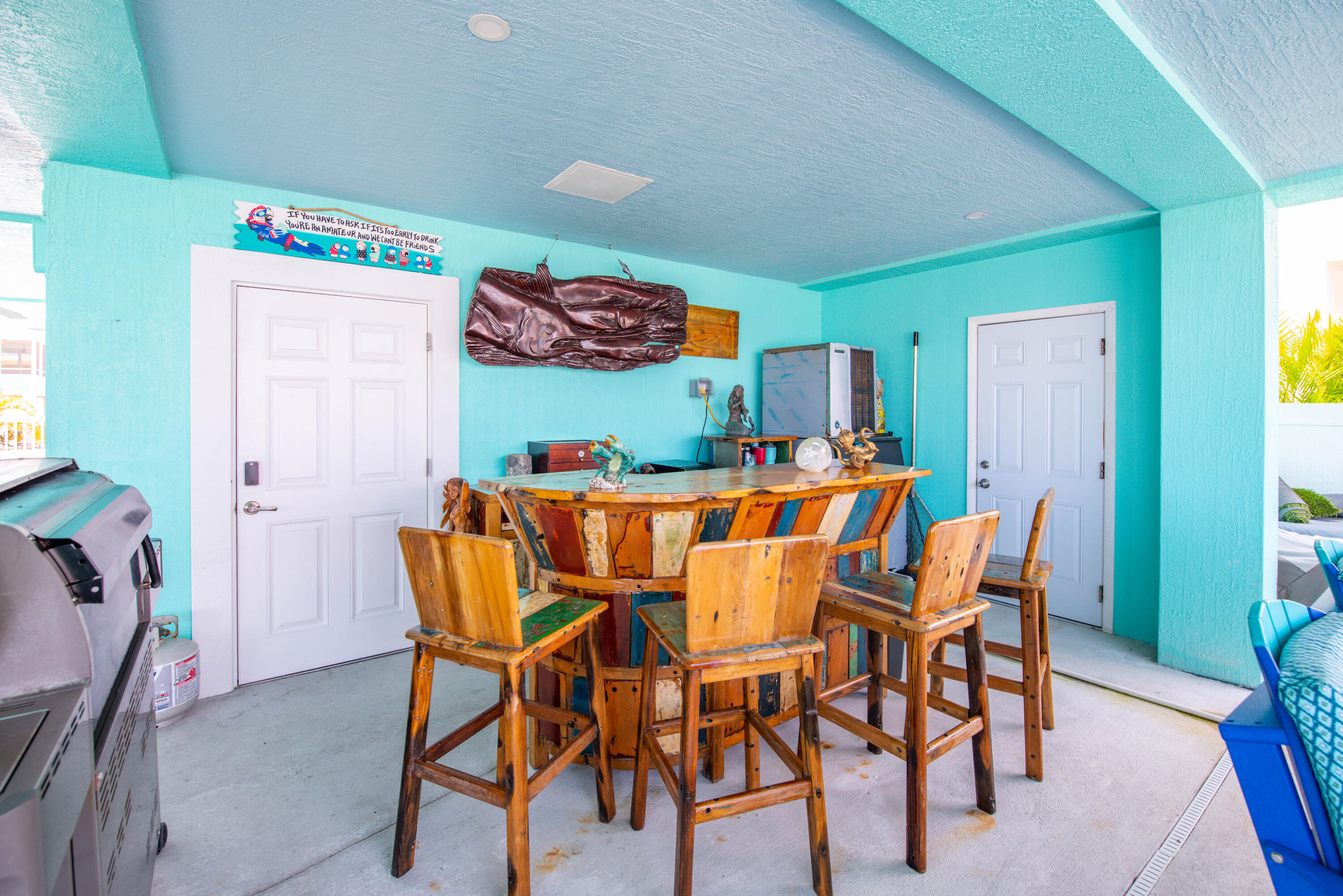 747 La Fitte Road Summerland Key, FL 33042 - Photo 46 of 103 a dining room filled with furniture and wooden floor