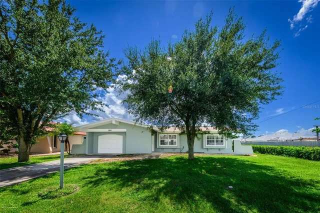 front view of a house with a yard