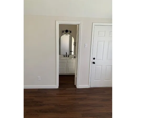 a view of a livingroom with wooden floor