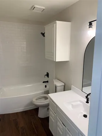 a bathroom with a sink a toilet and a bathtub