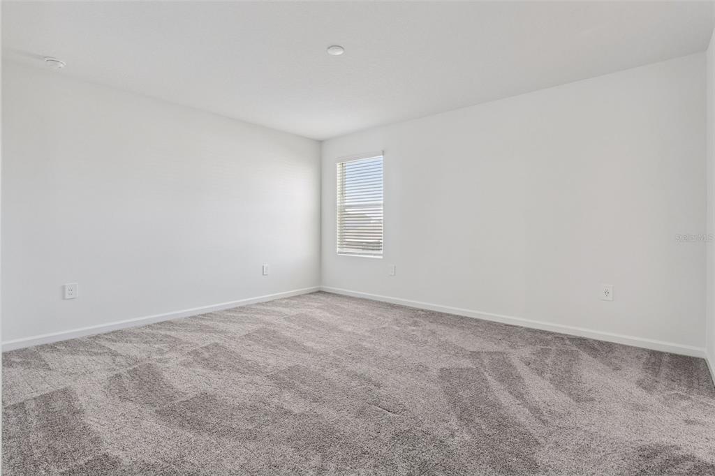 2916 Transformation Way Clermont, FL 34714 - Photo 15 of 91 a view of an empty room with a window