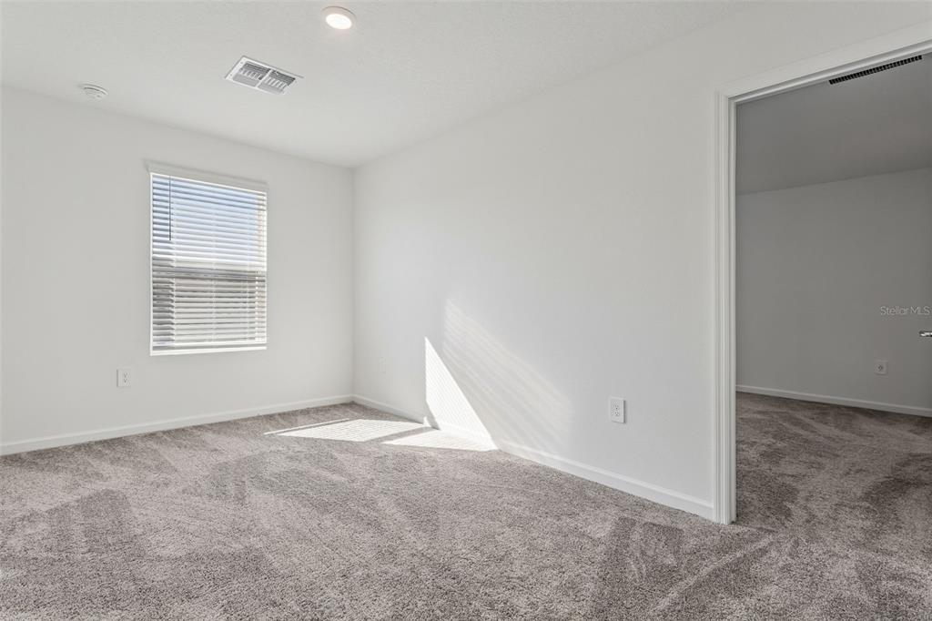 2916 Transformation Way Clermont, FL 34714 - Photo 20 of 91 a view of an empty room with a window