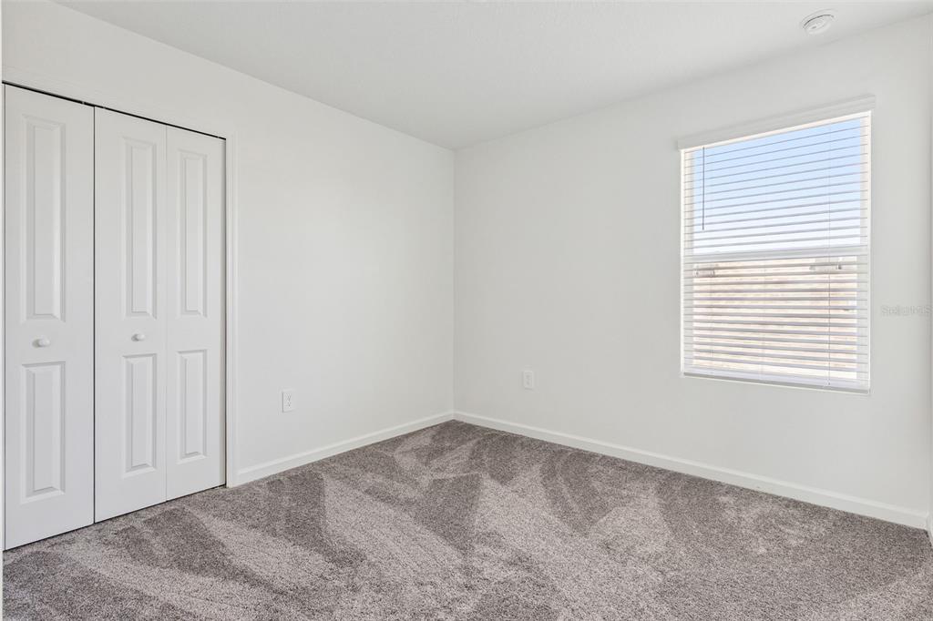 2916 Transformation Way Clermont, FL 34714 - Photo 22 of 91 an empty room with a window