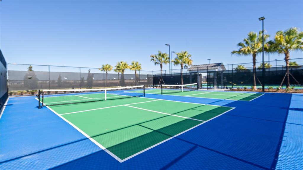 2916 Transformation Way Clermont, FL 34714 - Photo 69 of 91 a view of an outdoor space and tennis court