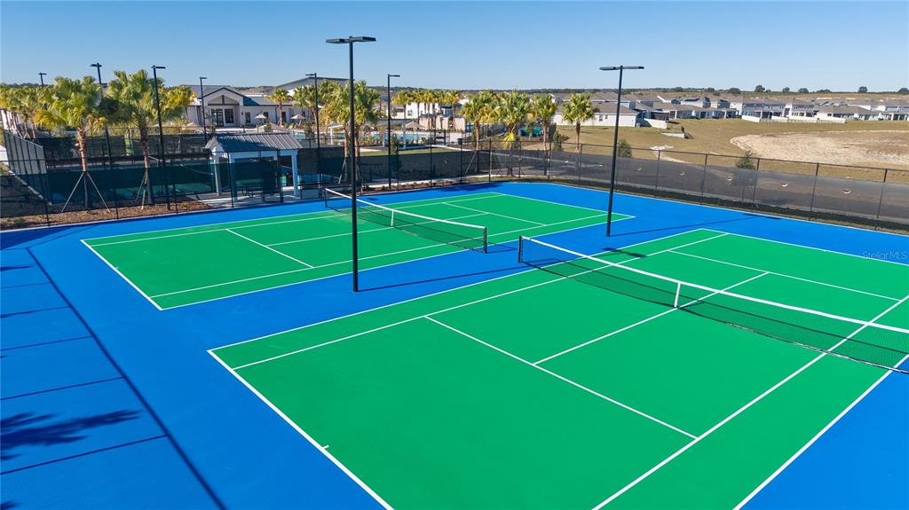 2916 Transformation Way Clermont, FL 34714 - Photo 89 of 91 a view of an outdoor space and tennis court