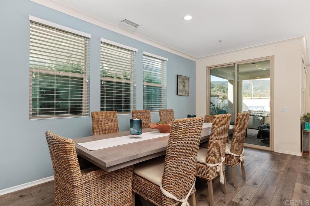 655 Merit Drive San Marcos, CA 92078 - Photo 11 of 35 a view of a dining room with furniture and windows
