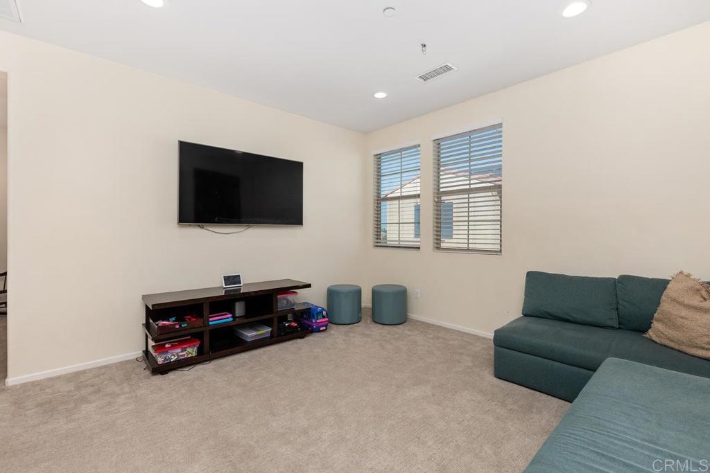 655 Merit Drive San Marcos, CA 92078 - Photo 15 of 35 a living room with furniture and a flat screen tv