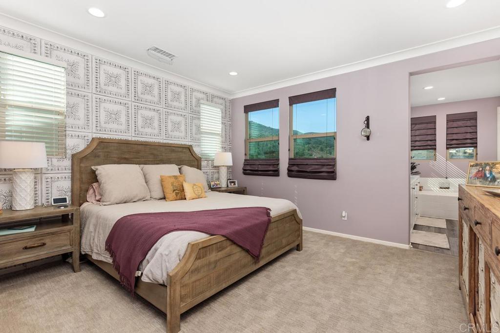 655 Merit Drive San Marcos, CA 92078 - Photo 17 of 35 a spacious bedroom with a bed and a window