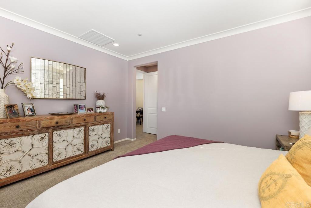 655 Merit Drive San Marcos, CA 92078 - Photo 18 of 35 a bedroom with a bed and wooden floor