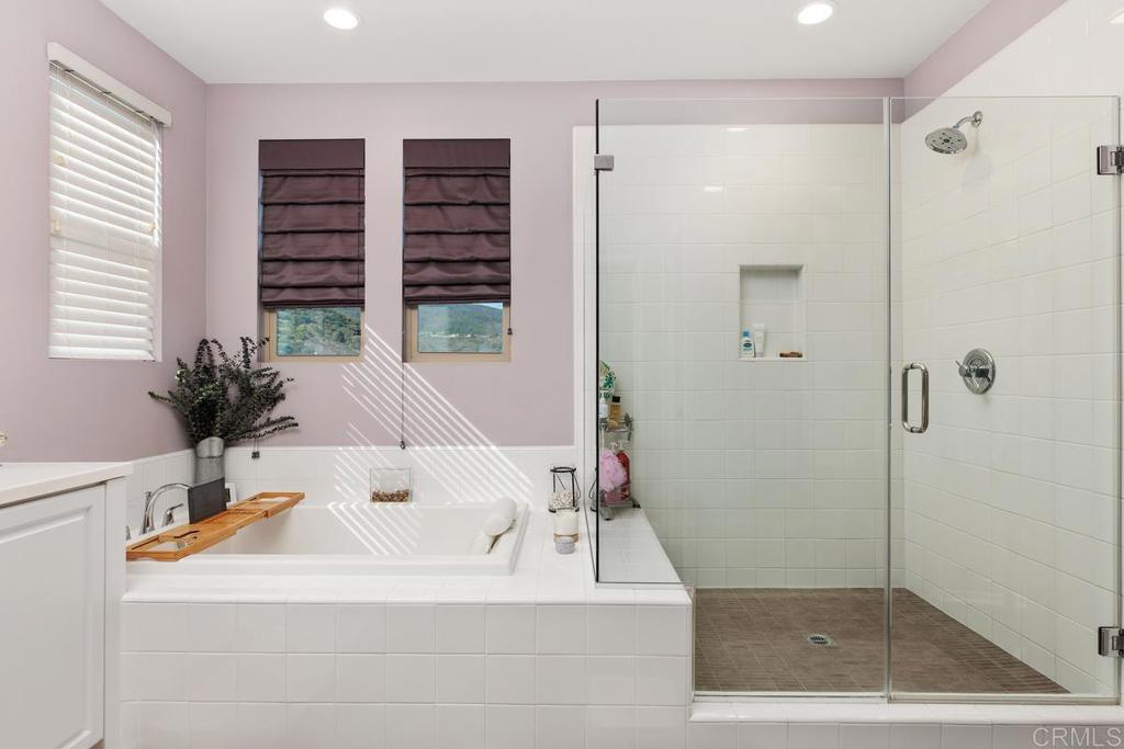 655 Merit Drive San Marcos, CA 92078 - Photo 19 of 35 a bathroom with a bathtub and a sink