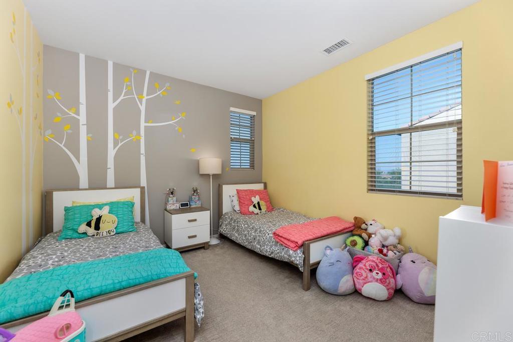 655 Merit Drive San Marcos, CA 92078 - Photo 21 of 35 a bedroom with a bed and a window