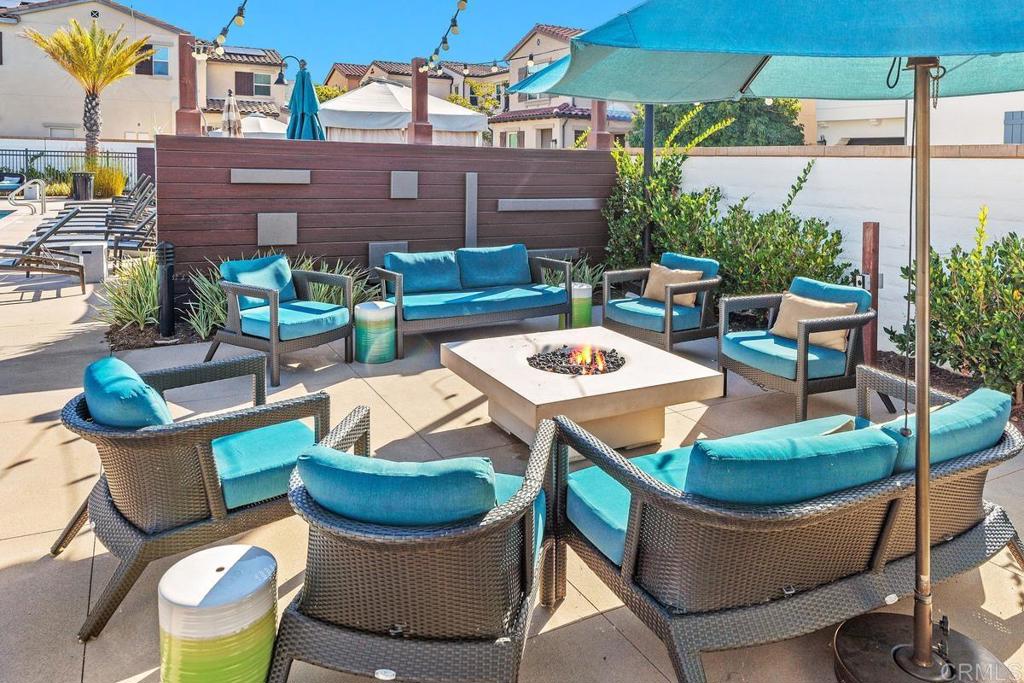 655 Merit Drive San Marcos, CA 92078 - Photo 29 of 35 a view of a patio with table and chairs potted plants