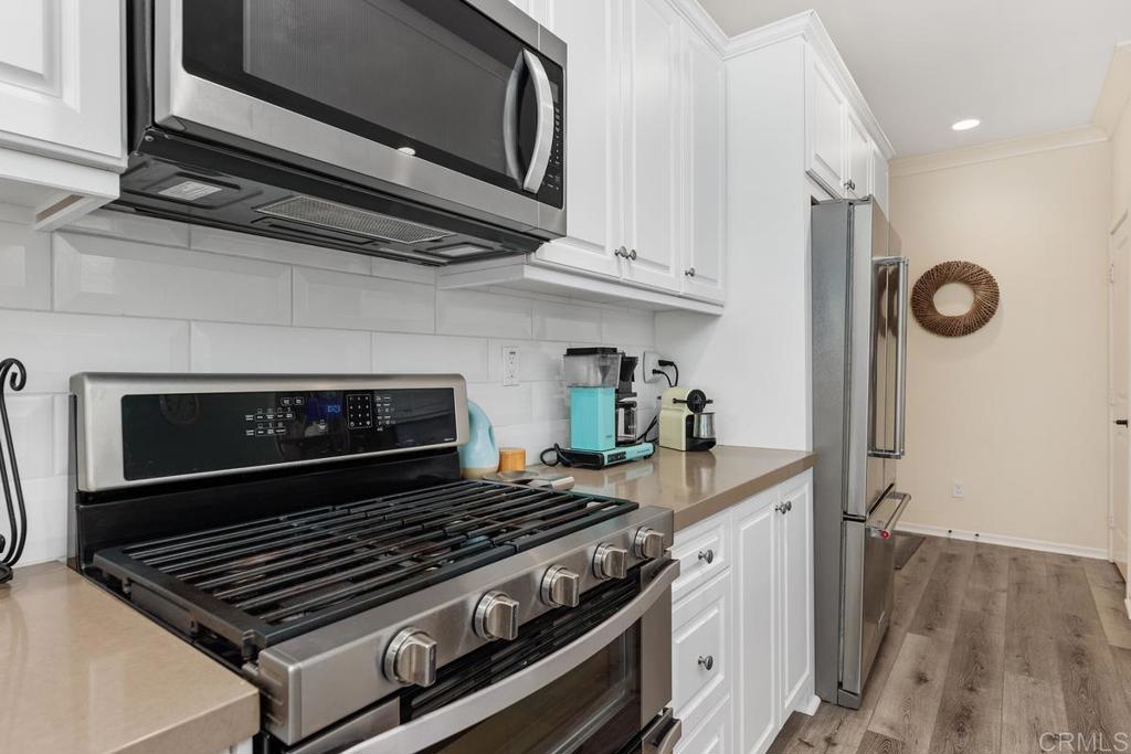 655 Merit Drive San Marcos, CA 92078 - Photo 9 of 35 a stove top oven sitting inside of a kitchen