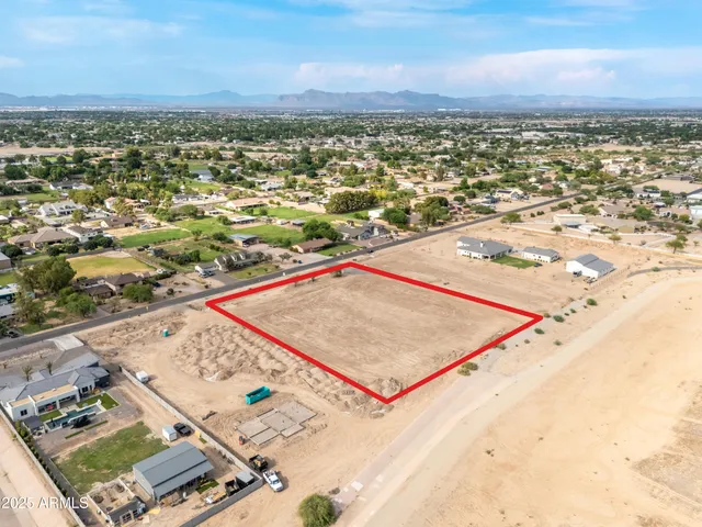 an aerial view of residential houses and outdoor space
