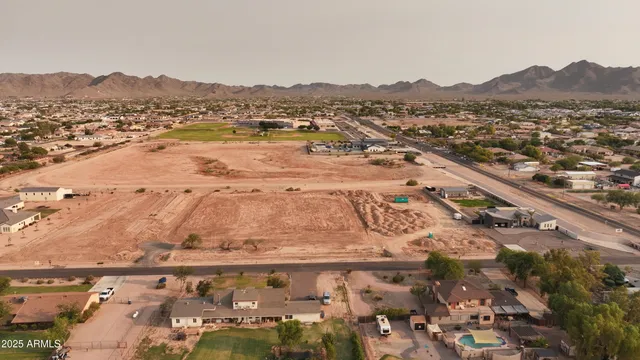 an aerial view of residential building and car parked