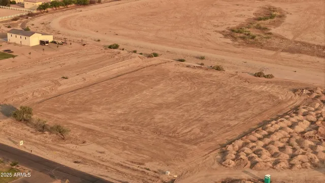an aerial view of residential houses with city view