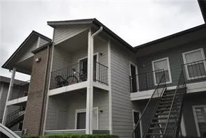 a view of an empty room and fire place