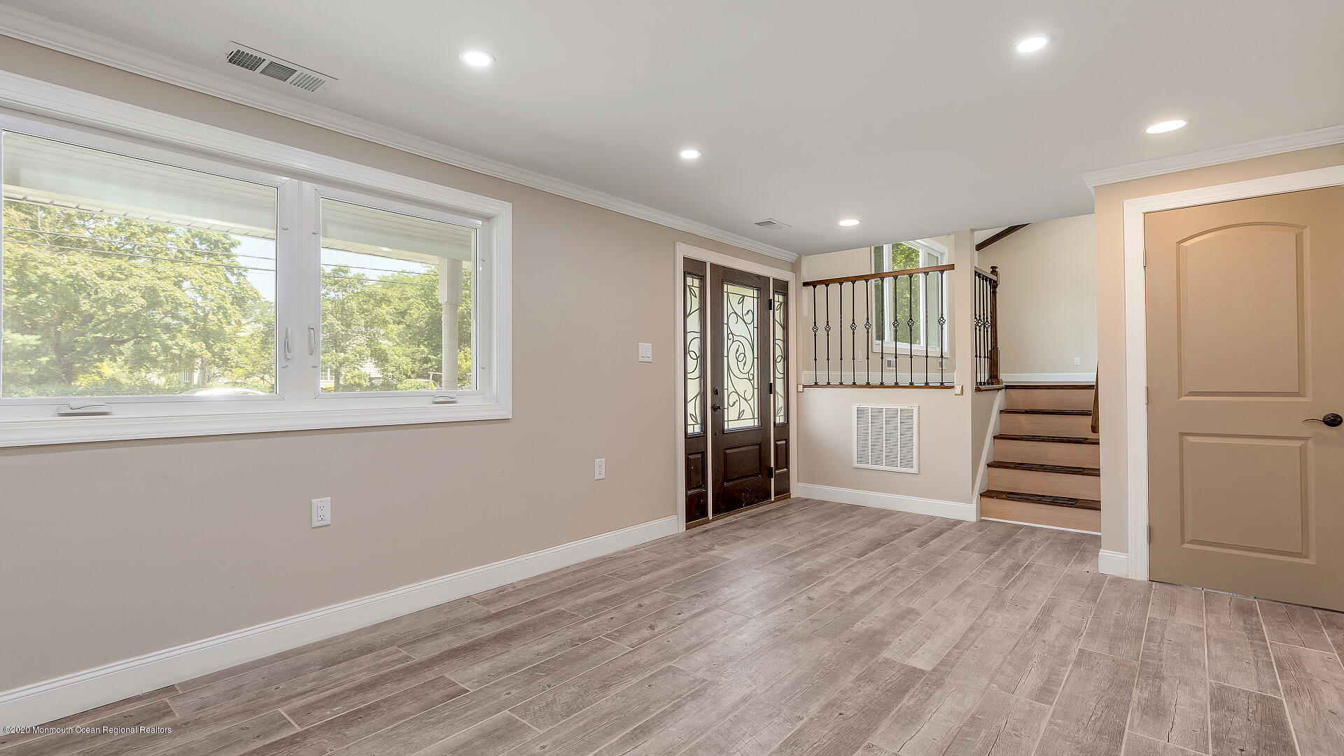 138 Cherry Tree Farm Road Middletown, NJ 07748 - Photo 2 of 47 a view of an empty room with wooden floor and stairs