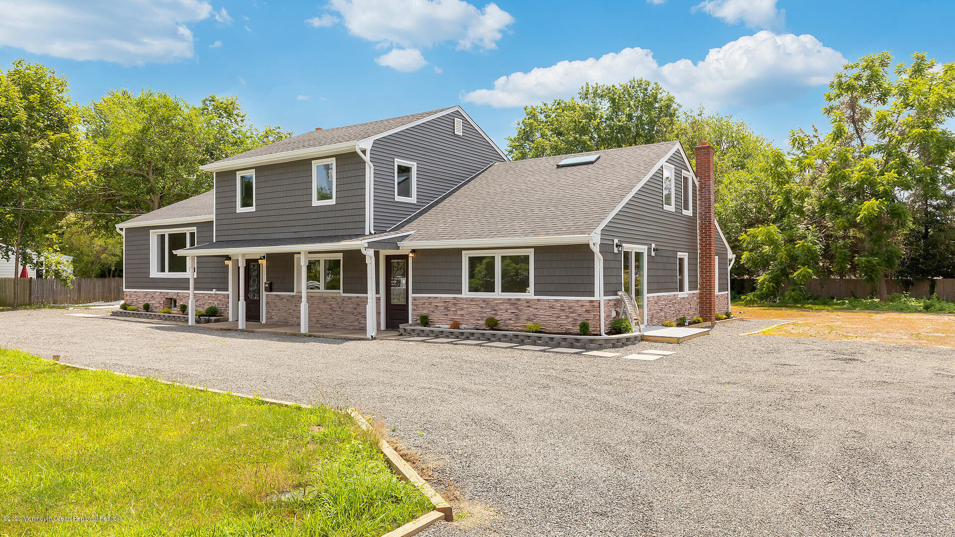 138 Cherry Tree Farm Road Middletown, NJ 07748 - Photo 39 of 47 a front view of a house with a yard table and chairs
