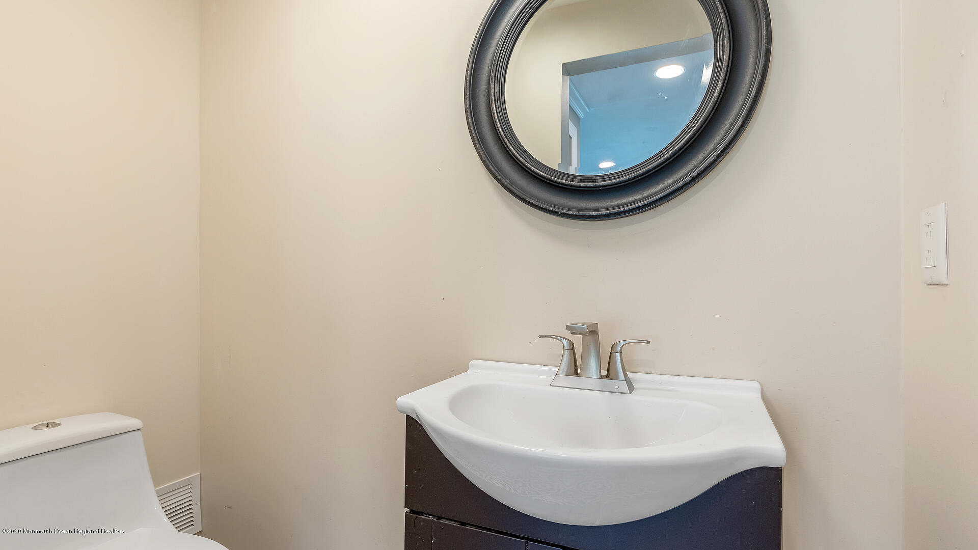 138 Cherry Tree Farm Road Middletown, NJ 07748 - Photo 4 of 47 a bathroom with a sink and a mirror
