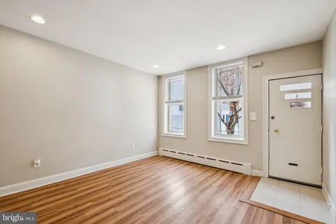 a view of entryway with wooden floor