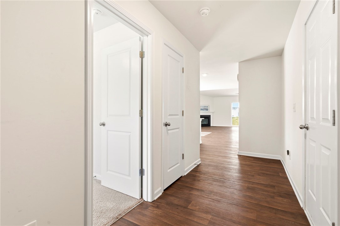 205 Hillendale Way Pelzer, SC 29669 - Photo 12 of 29 A welcoming entryway with gleaming wood floors leads to an inviting living space.
