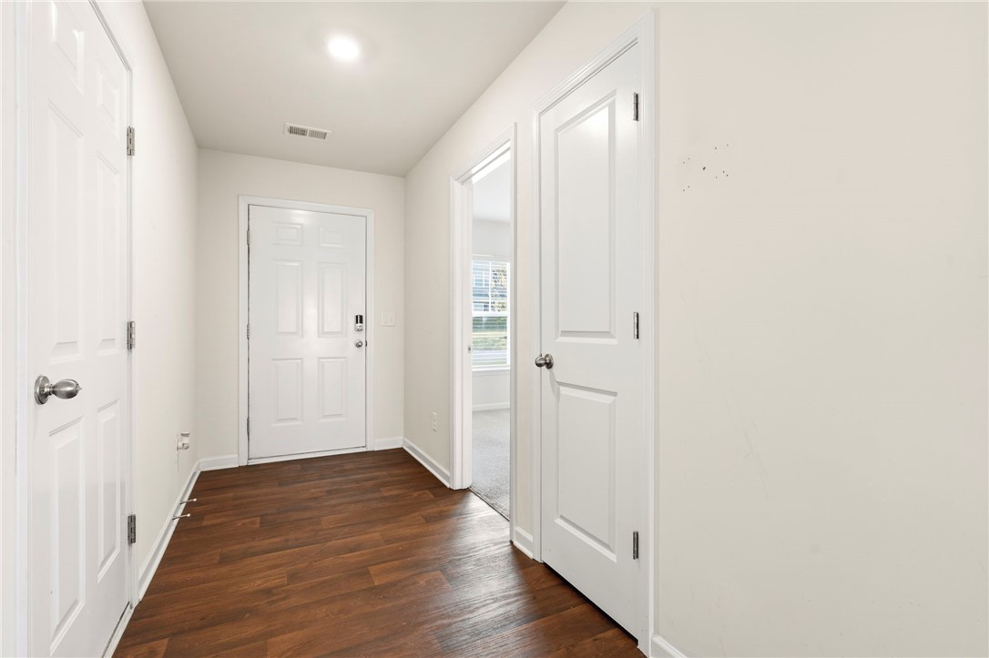 205 Hillendale Way Pelzer, SC 29669 - Photo 13 of 29 This entry hall features durable flooring and leads to inviting living spaces.