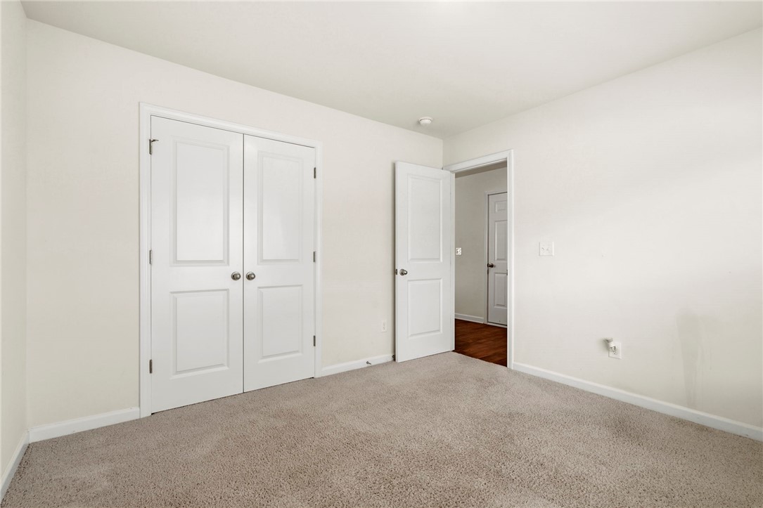 205 Hillendale Way Pelzer, SC 29669 - Photo 14 of 29 This spacious bedroom offers ample natural light, soft carpeting, and a neutral palette awaiting your personal touch.