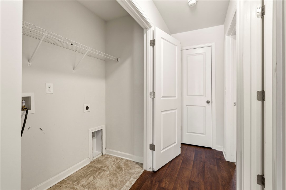 205 Hillendale Way Pelzer, SC 29669 - Photo 19 of 29 This dedicated laundry area offers practical convenience with essential hookups and shelving.