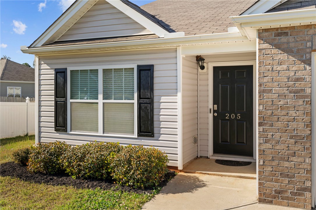 205 Hillendale Way Pelzer, SC 29669 - Photo 2 of 29 This charming residence features classic siding and a welcoming entrance with manicured landscaping.
