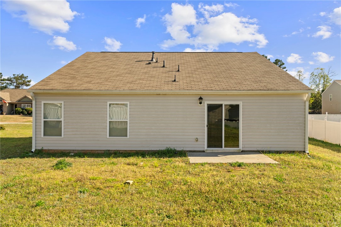 205 Hillendale Way Pelzer, SC 29669 - Photo 21 of 29 This property features a well-maintained exterior and a comfortable patio, perfect for outdoor enjoyment.