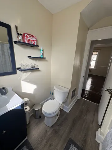 a bathroom with a sink toilet and vanity