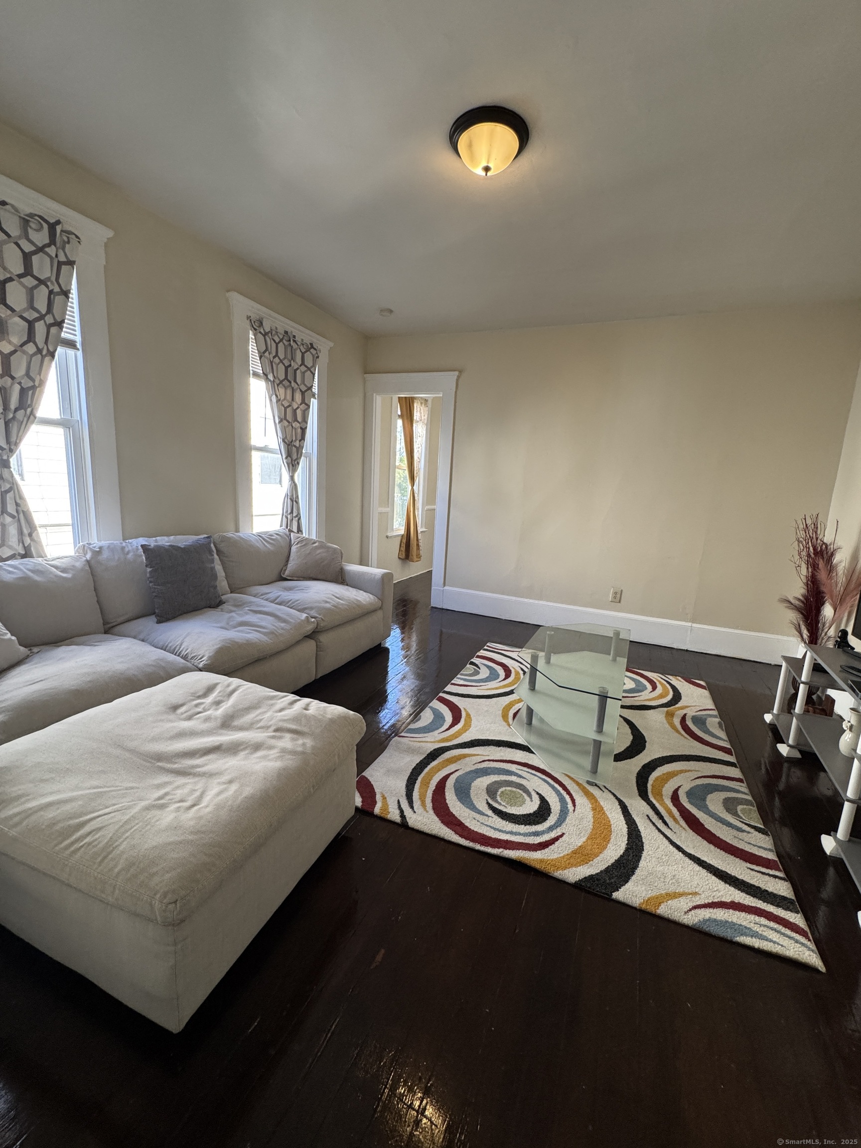766 George Street, Unit 2 New Haven, CT 06511 - Photo 2 of 20 a view of a livingroom with furniture and a window