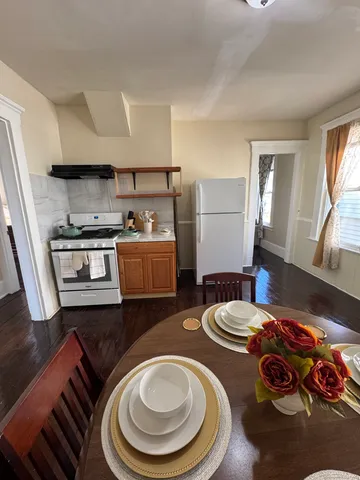 a kitchen with stainless steel appliances a stove a sink and a refrigerator