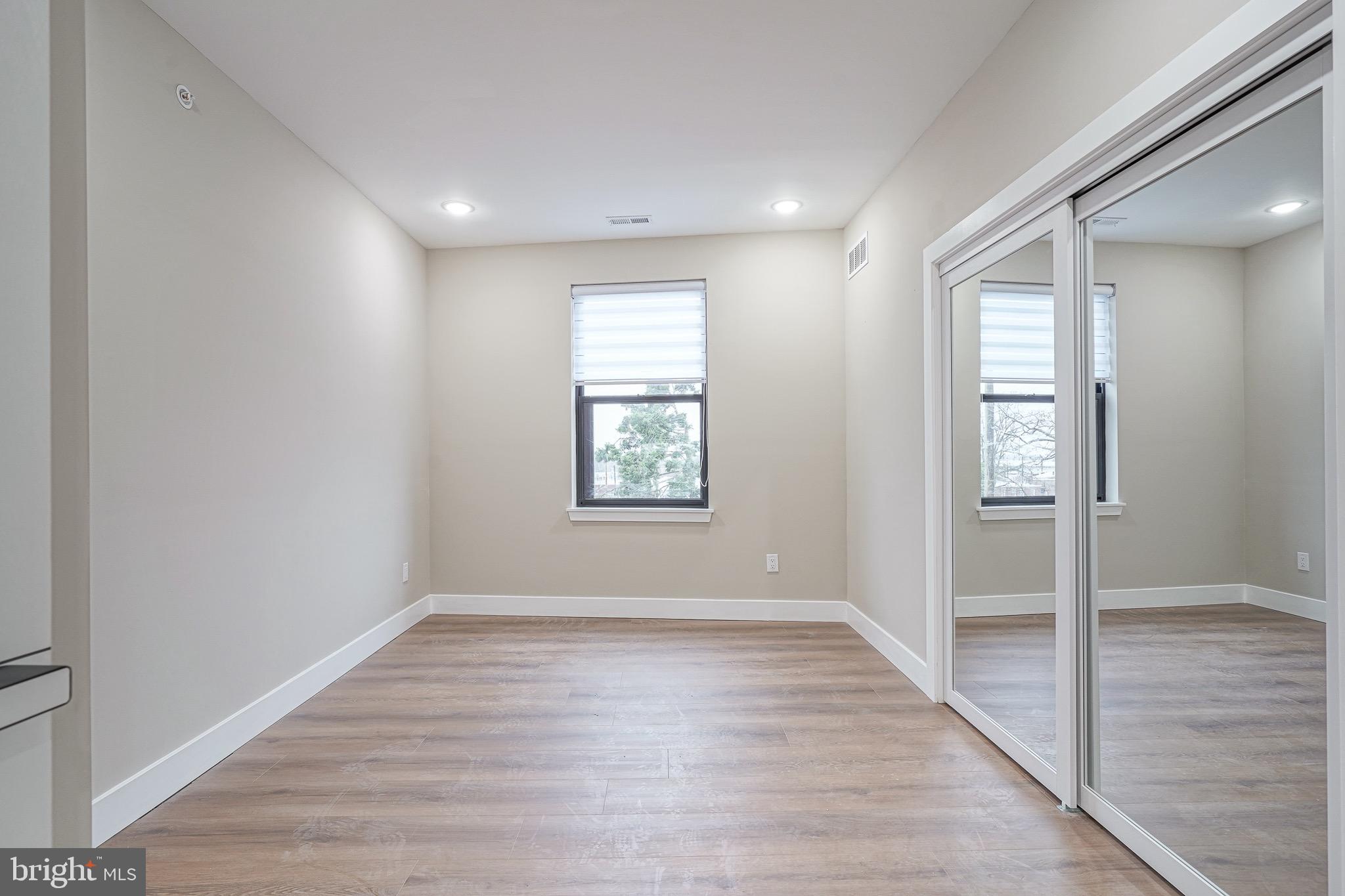 4432-00 Wingate Street, Unit 202 Philadelphia, PA 19136 - Photo 11 of 32 wooden floor in an empty room with a window