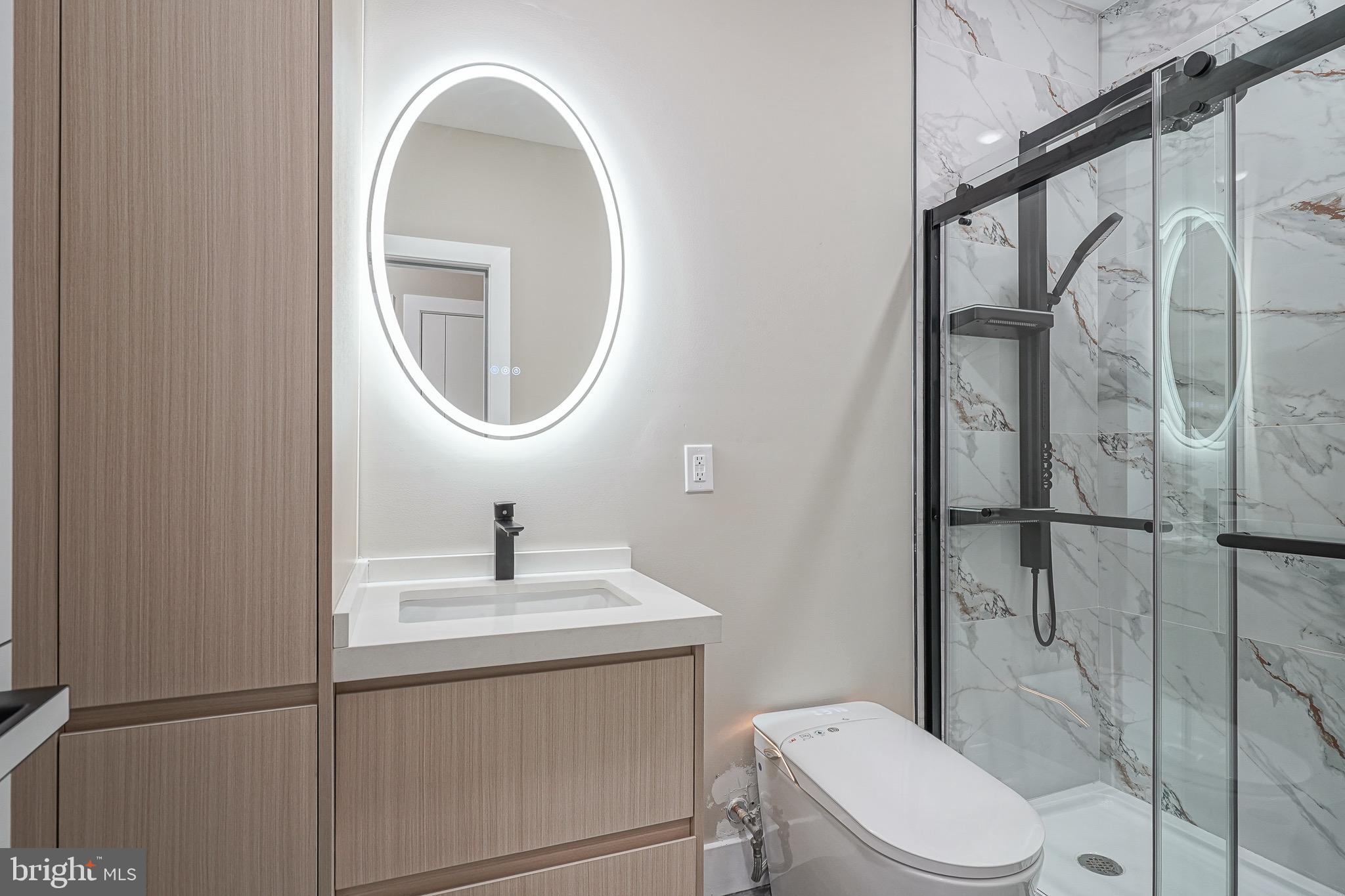 4432-00 Wingate Street, Unit 202 Philadelphia, PA 19136 - Photo 13 of 32 a bathroom with a toilet sink and shower