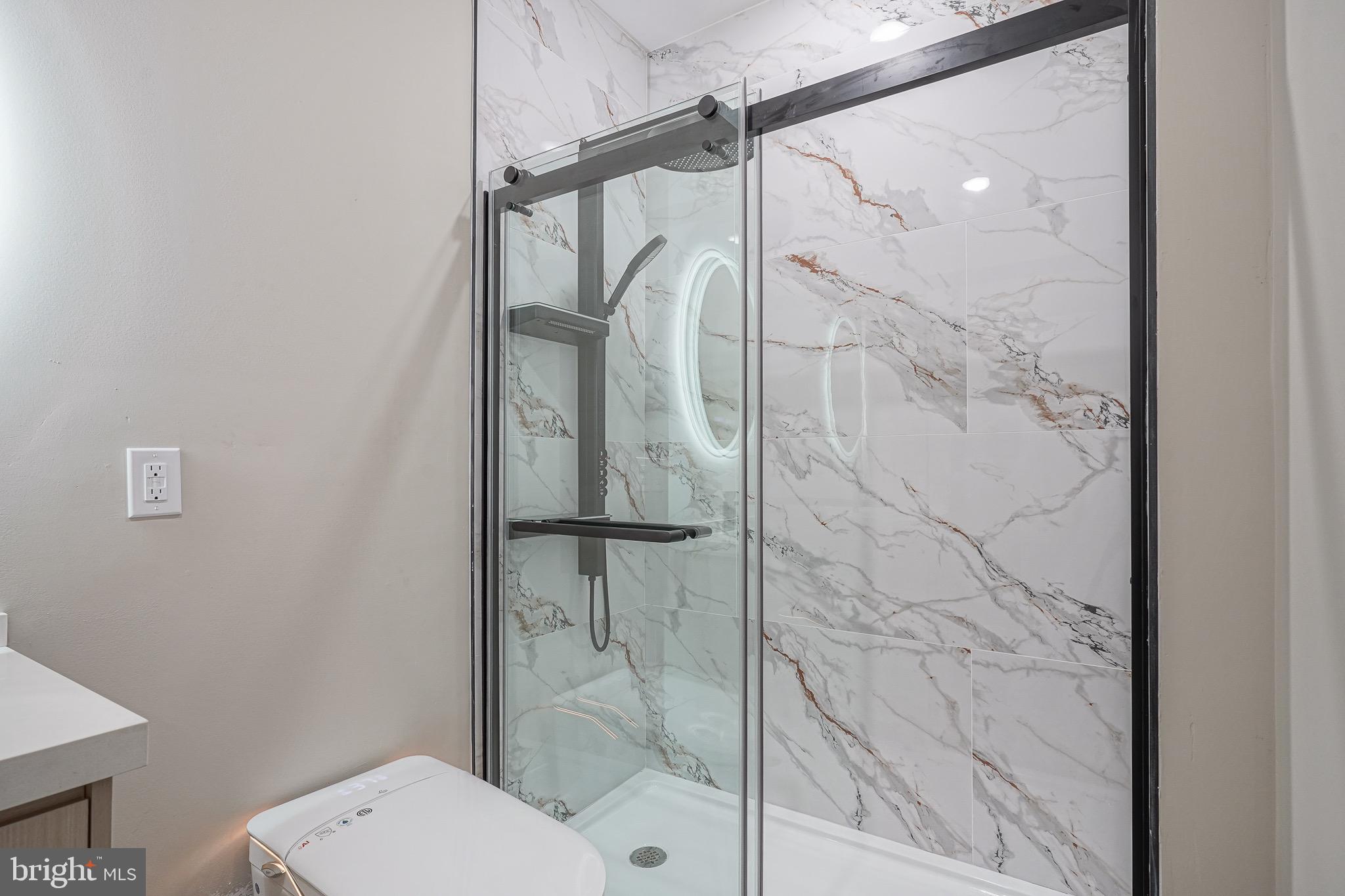 4432-00 Wingate Street, Unit 202 Philadelphia, PA 19136 - Photo 14 of 32 a bathroom with a shower and toilet