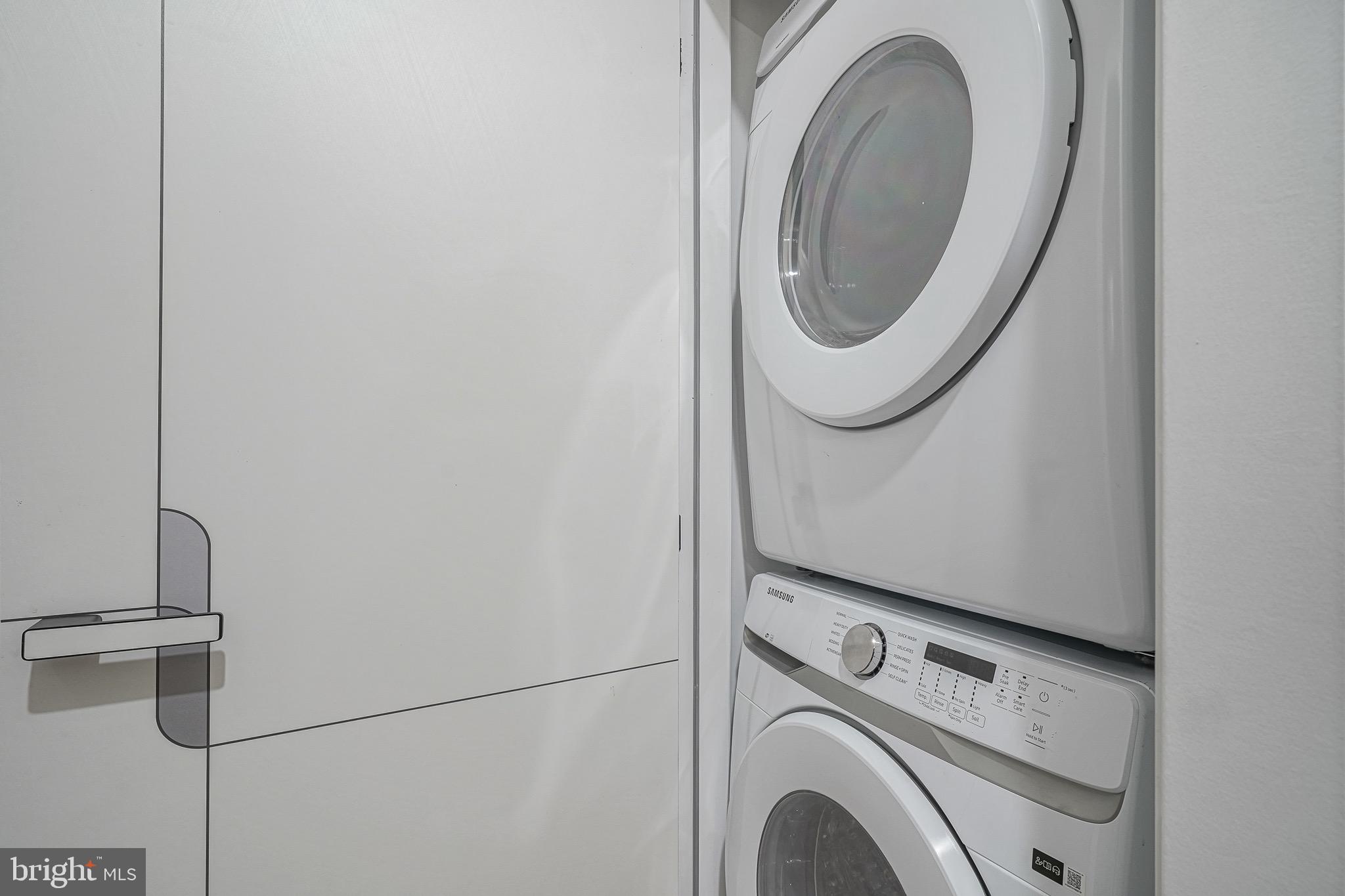 4432-00 Wingate Street, Unit 202 Philadelphia, PA 19136 - Photo 15 of 32 a utility room with dryer and washer