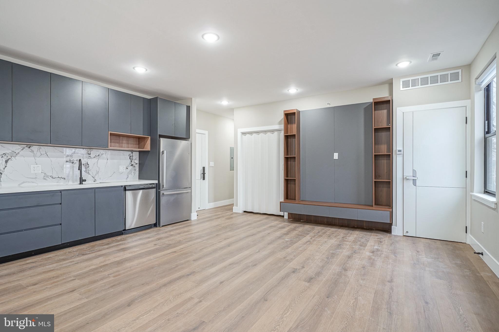 4432-00 Wingate Street, Unit 202 Philadelphia, PA 19136 - Photo 20 of 32 a view of kitchen with stainless steel appliances granite countertop a refrigerator and a sink