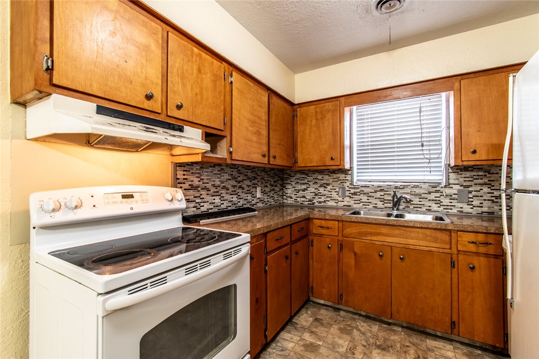 5802 Limerick Drive Corpus Christi, TX 78413 - Photo 11 of 34 a view of a kitchen with sink washer and dryer