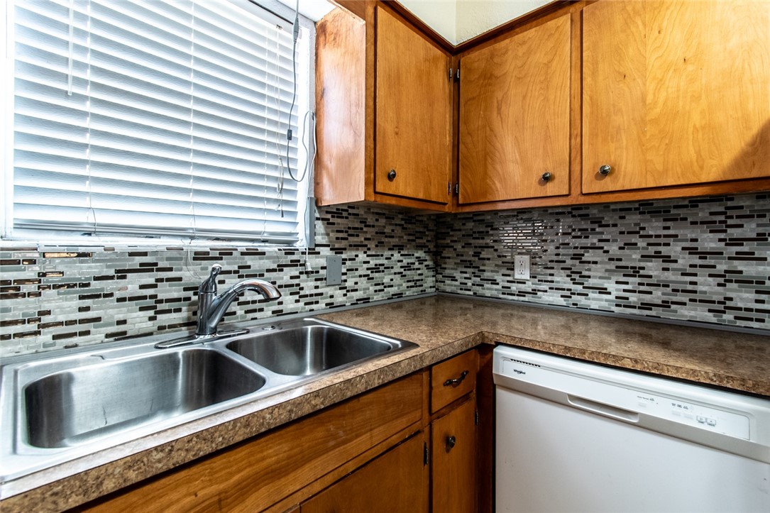 5802 Limerick Drive Corpus Christi, TX 78413 - Photo 12 of 34 a kitchen with granite countertop a sink and a window