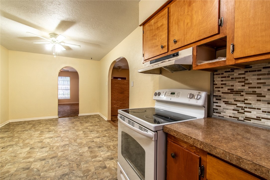 5802 Limerick Drive Corpus Christi, TX 78413 - Photo 13 of 34 a kitchen with a stove and a sink